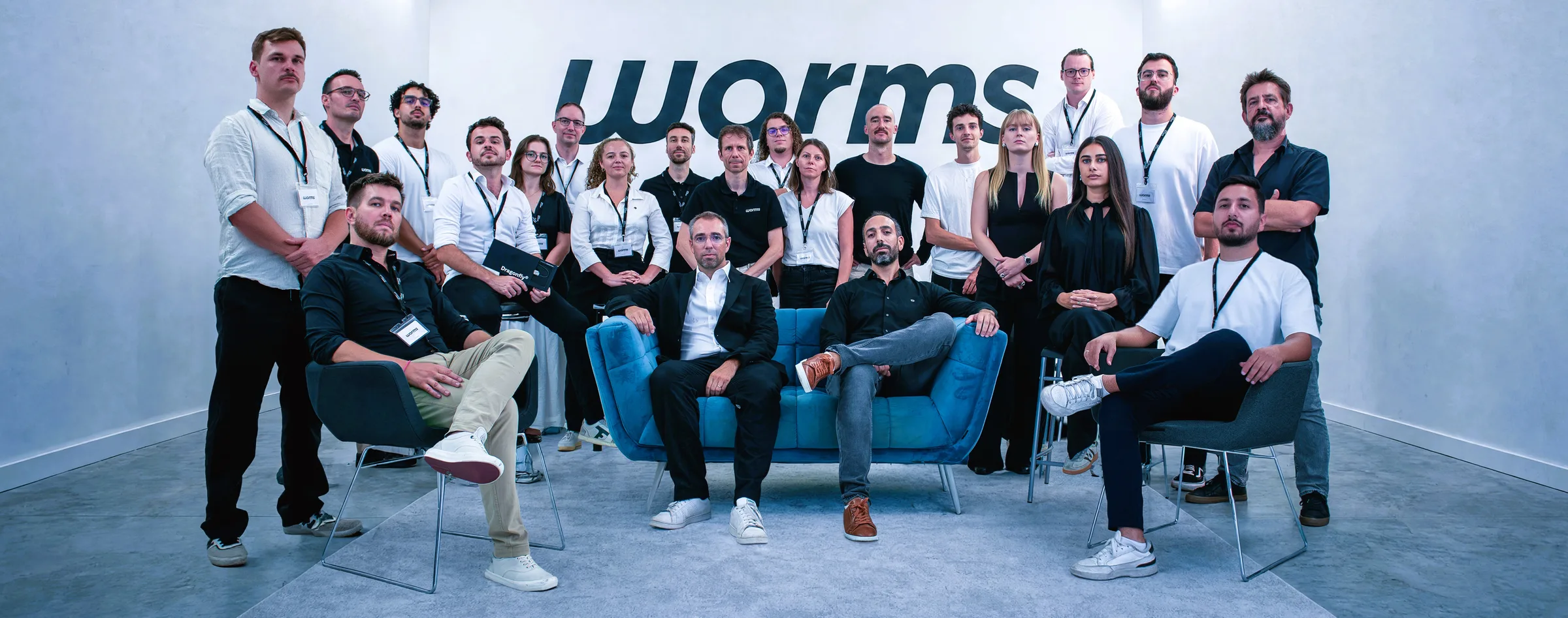 The Wormsensing team, in a white room in front of the worms logo