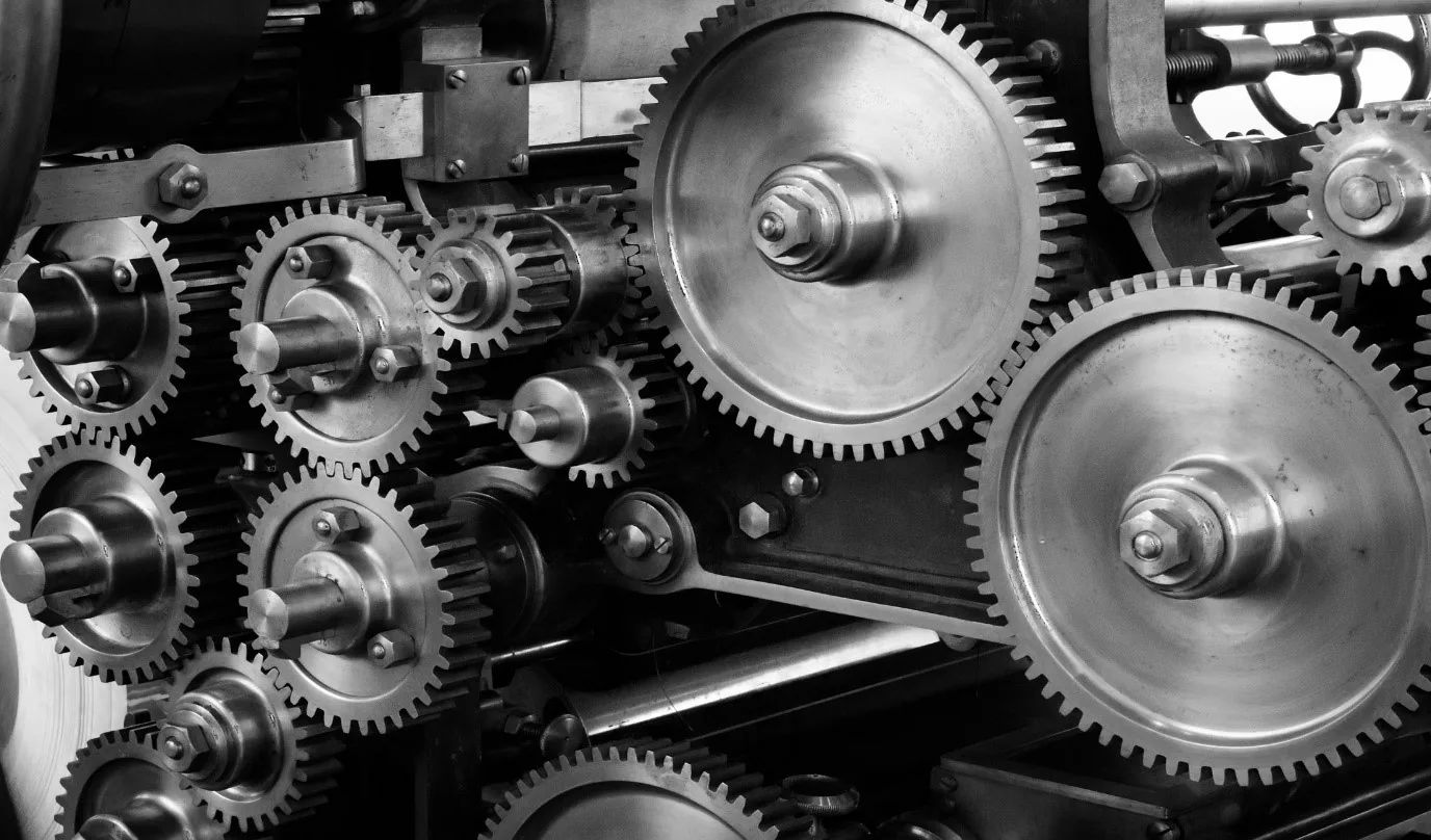 The gear train of an industrial gearbox, close up.