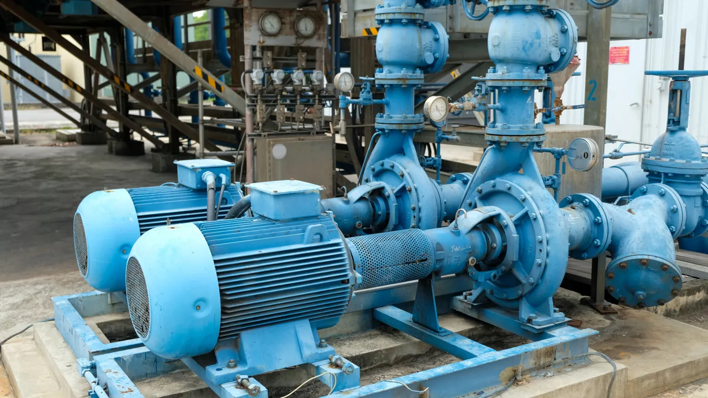 Electric motors driving centrifugal pumps in an industrial plant.