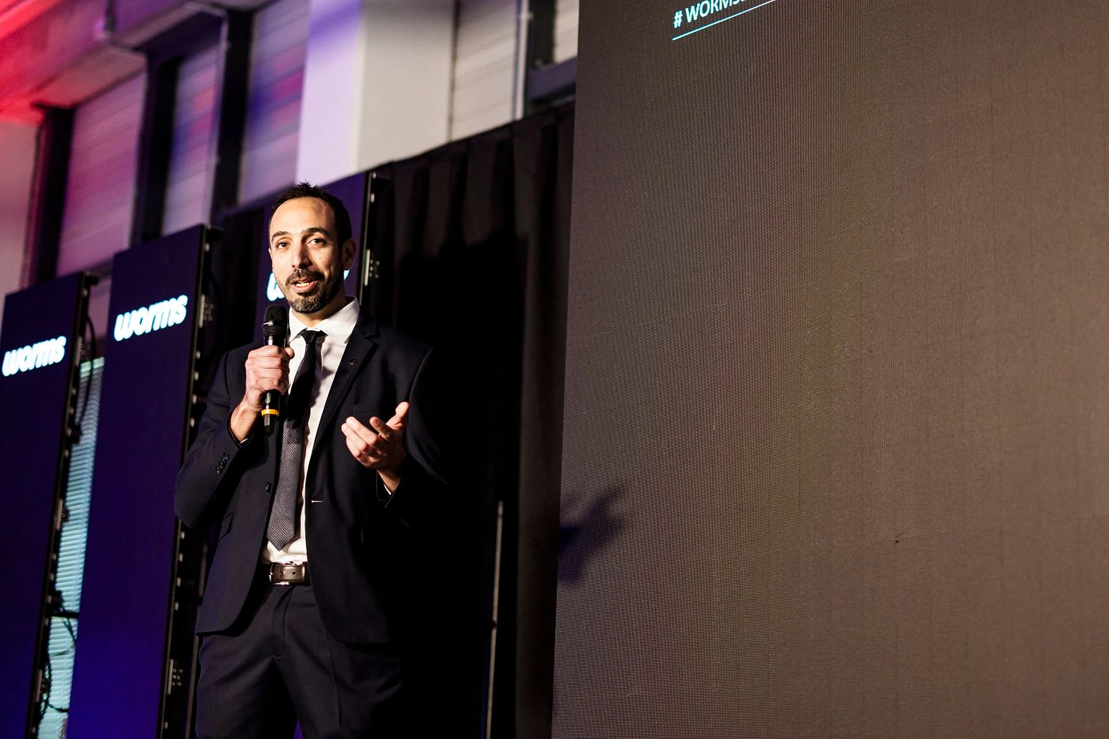 Lamine Benaissa on stage at the inauguration of Wormsensing's first production line